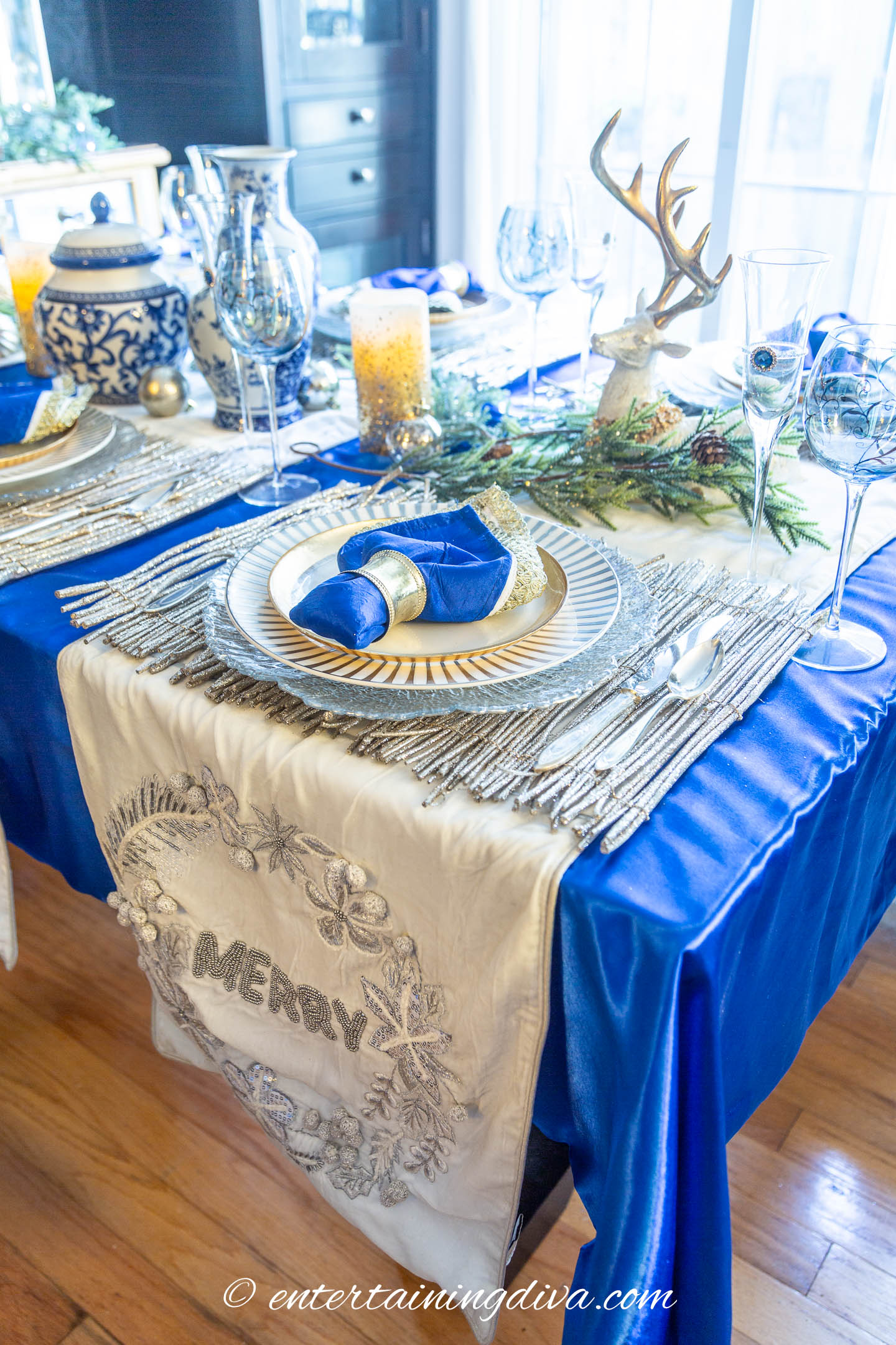 Blue and white Christmas tablescape with a blue tablecloth