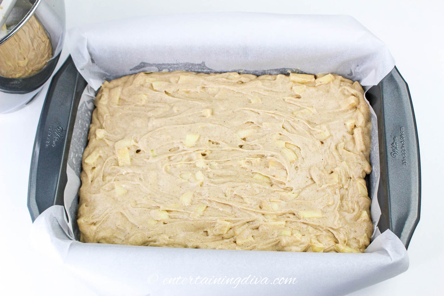 caramel apple sheet cake in a pan before being baked