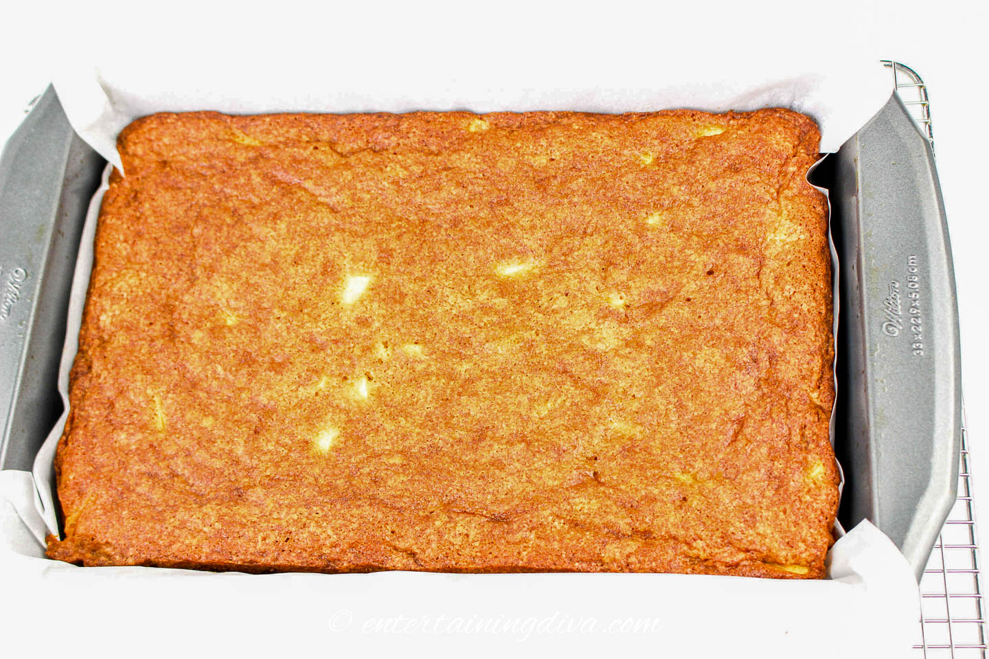 caramel apple sheet cake in a pan after being baked