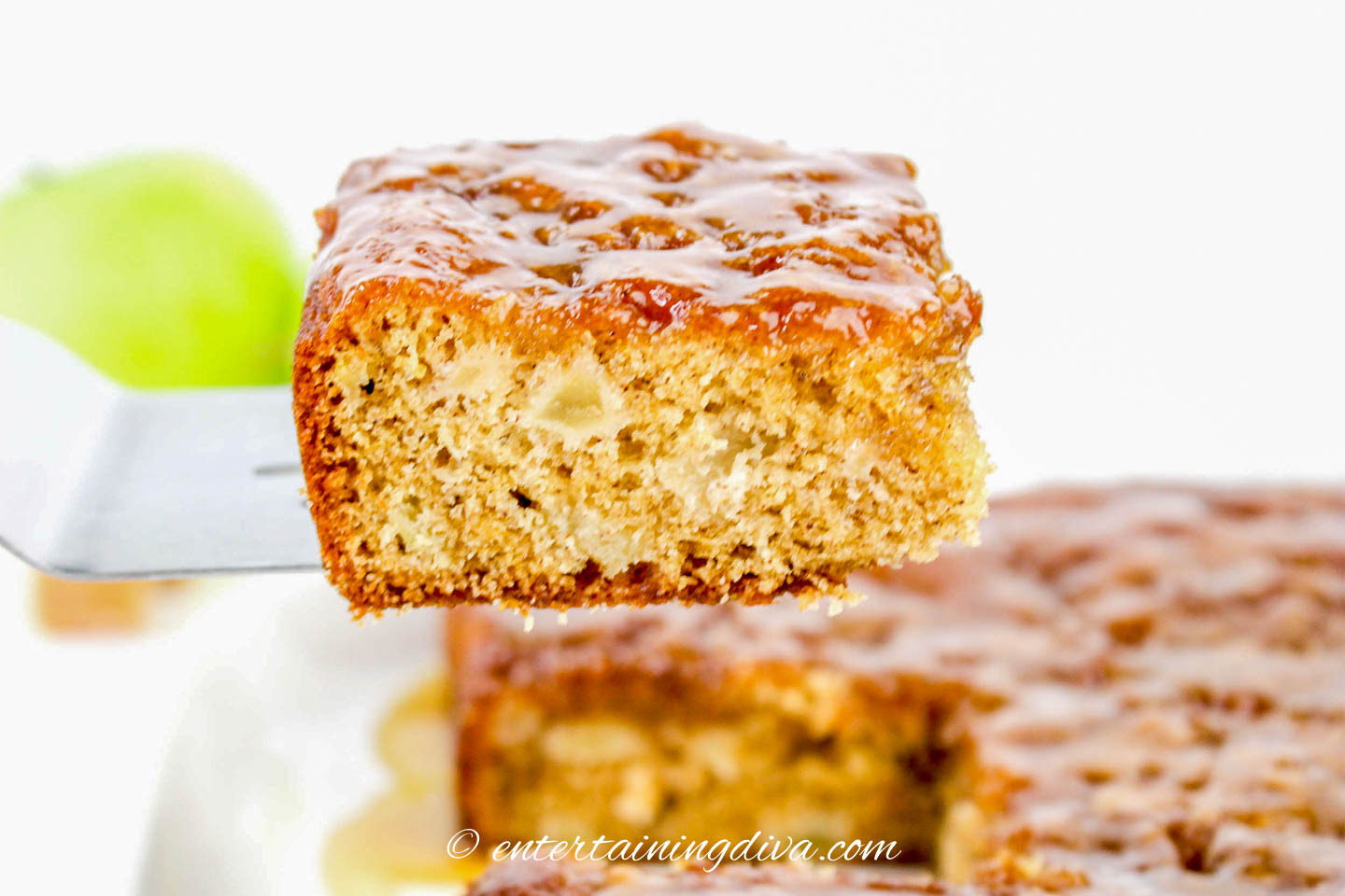 one piece of caramel apple sheet cake being served