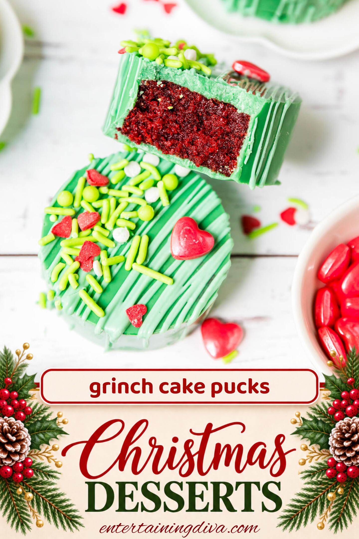 Close up of a Grinch cake puck with a bite taken out of it showing the red velvet cake inside