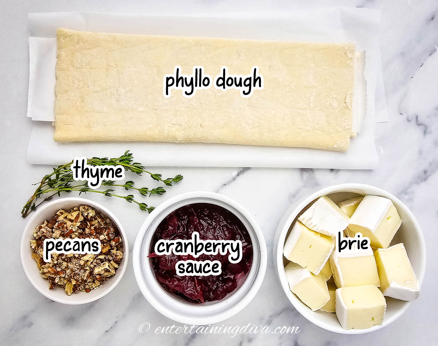cranberry brie bites ingredients - phyllo dough, thyme, pecans, cranberry sauce and brie