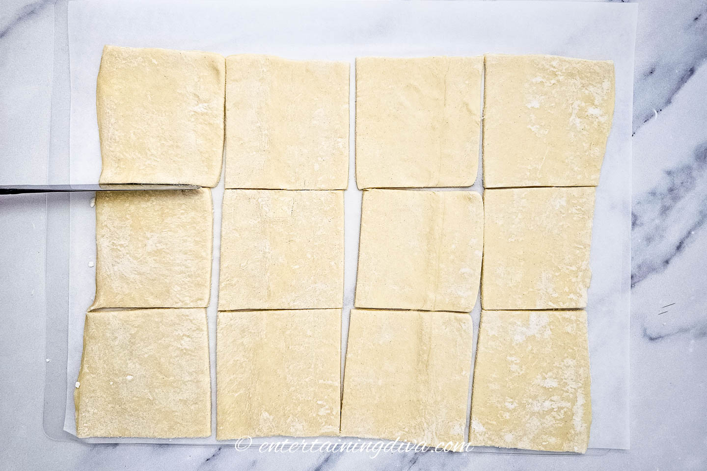 a sheet of phyllo dough cut into 12 squares