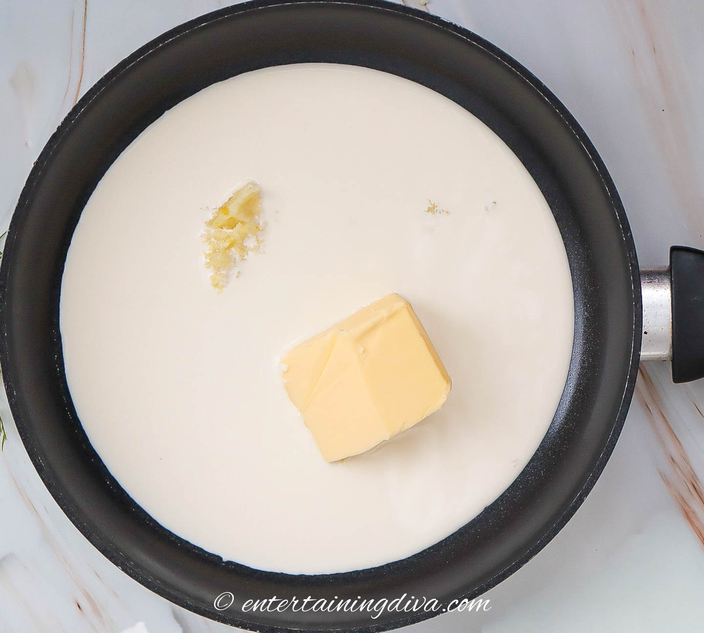 cream, butter and garlic in a sauce pan
